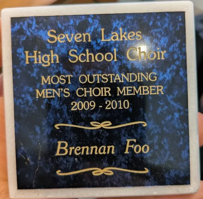 Plaque reading “Seven Lakes High School Choir, Most Outstanding Men’s Choir Member, 2009–2010, Brennan Foo.”